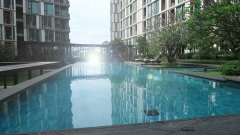 Blue water pool with bright sun light ray n bokeh lens flare effect Stock Footage 147573504