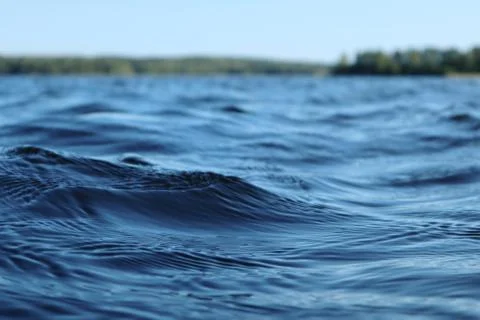 Blue water sky sunny day finnish lake water waves Stock Photos