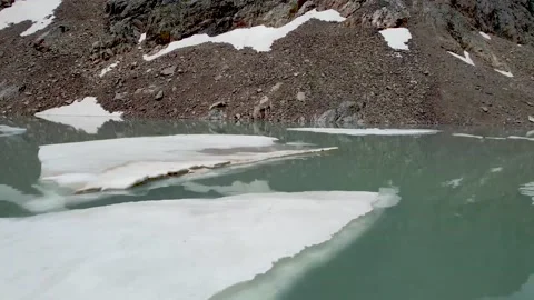 Blue water with snow floating in it Stock Footage 212196332