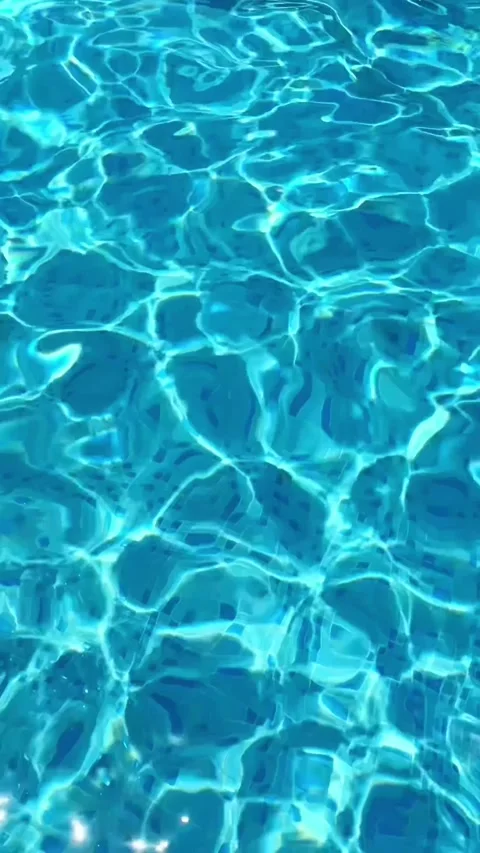 Blue water with sun reflections on the surface of the pool Stock Footage 320522940