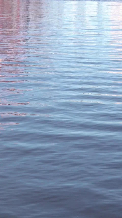 Blue water surface with abstract cityscape reflections Видео 333327592