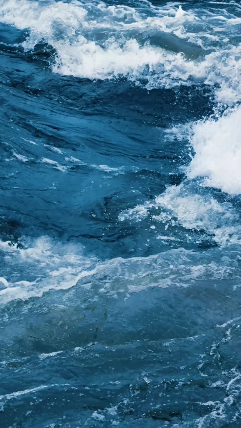 Blue water surface background. Sea waves on the beach. Vertical video  Stock Footage 302900067