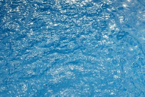 Blue water surface with bubbles Stock Photos