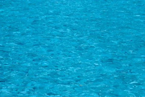 Blue water surface with small waves Stock Photos