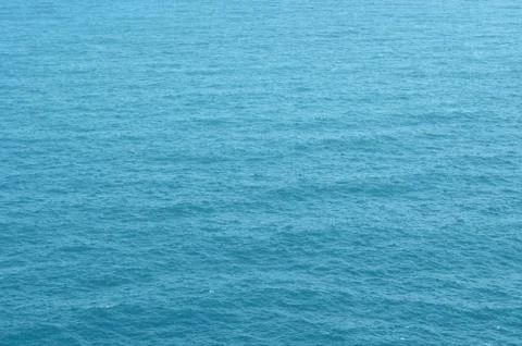 Blue water surface with smooth wave texture Stock Photos