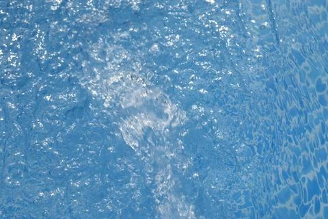 Blue water surface with splash Stock Photos