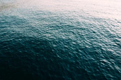 Blue water surface texture with soft waves background Stock Photos