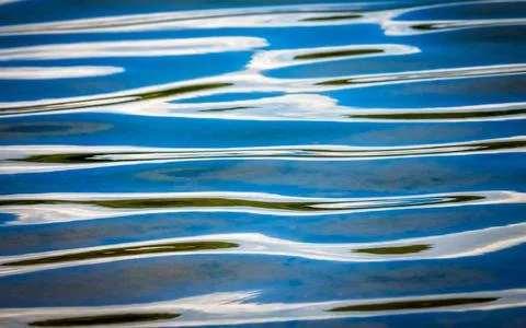 Blue water surface waves pattern Abstract image of a blue water surface pa... Stock Photos