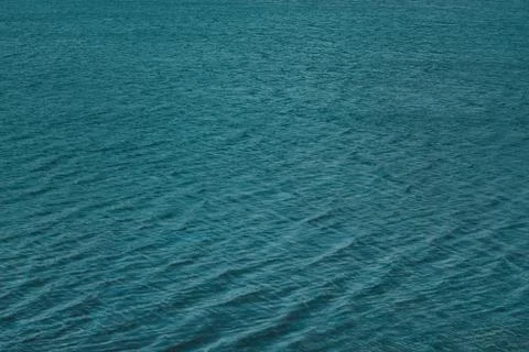 Blue water surface with waves texture Stock Photos