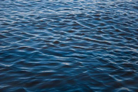 Blue water surface waves wind freshness of summer Stock Photos