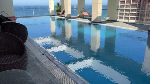 Blue water in the swimming pool with light reflections.,Close-up of clear blue Stock Footage 323921268