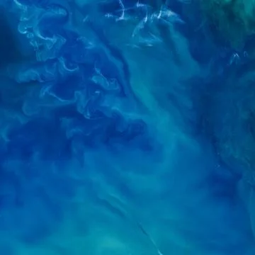 Blue water texture background. Elements of this image furnished by NASA. Stock Photos
