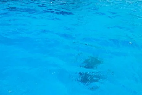 Blue water texture background. Surface of sea or ocean Stock Photos