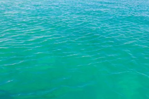 Blue water texture background. Surface of sea or ocean Stock Photos