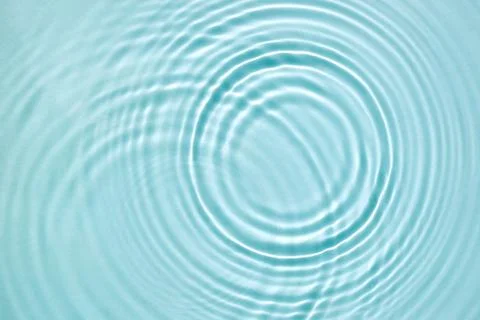 Blue water texture, blue mint water surface with rings and ripples. Spa con.. Stock Photos