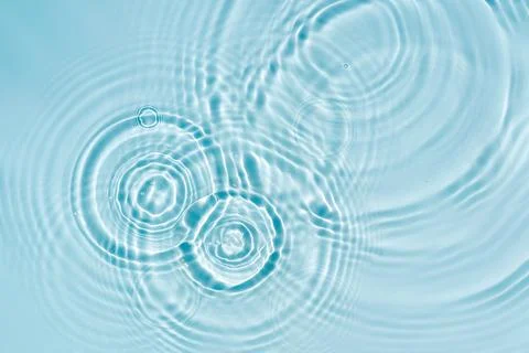 Blue water texture, blue mint water surface with rings and ripples. Spa con.. Stock Photos