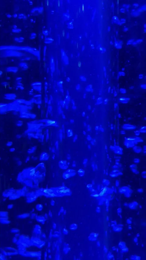 Blue water vortex going up with air bubbles. Vertical abstract, 4k Stock Footage 287368563