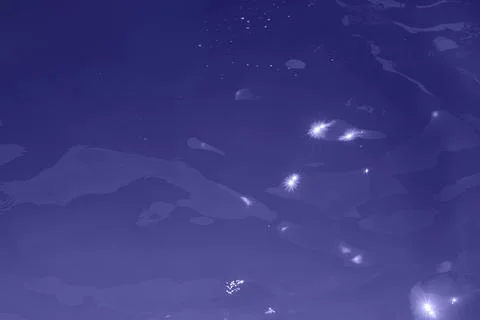 Blue water wave texture background. Rippled water. Shiny purple and blue water Stock Photos