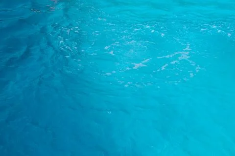 Blue water wave texture background. Rippled water. Shiny purple and blue water Foto stock