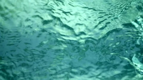 Blue water waves surface close up in swimming pool, background with copy space. 库存影片 252016574
