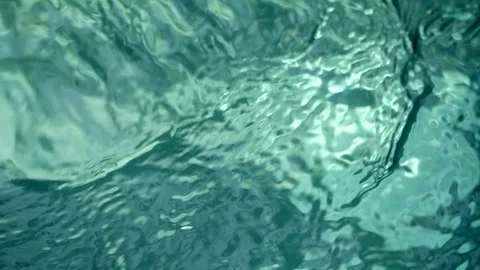 Blue water waves surface close up in swimming pool, background with copy space. 库存影片 252116605