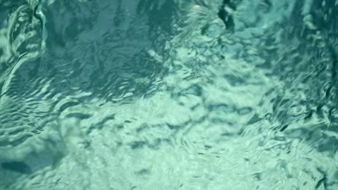 Blue water waves surface close up in swimming pool, background with copy space. Stockbeeldmateriaal 255992951