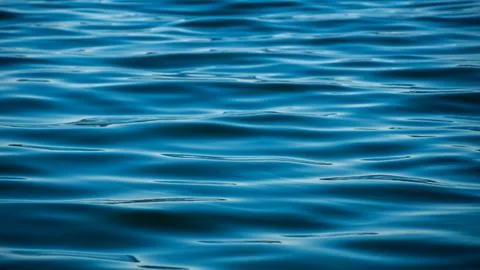 Blue water with waves on the surface Stock Photos
