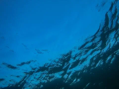 Blue water with waves while diving at a lake Stock Photos