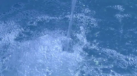 Blue waterfall drops closeup, transparent water, clear environment. Video stock 40669058