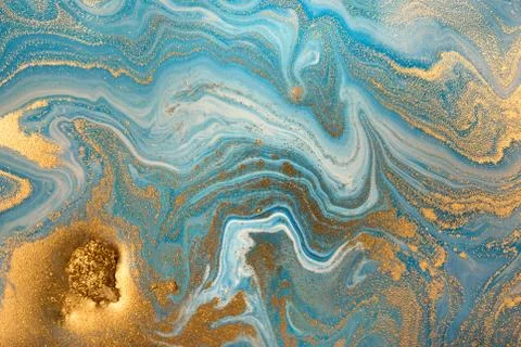 Blue wave pattern with layers of gold sequins. Foto stock