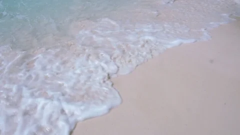 Blue wave on a sandy beach Stock Footage 74024128