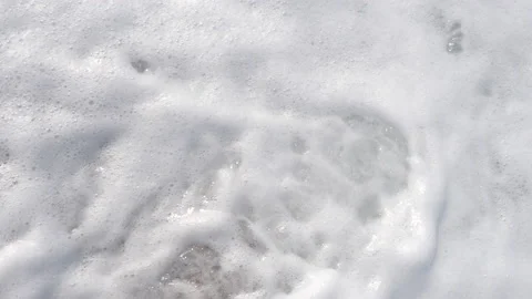 The blue wave washes over the pebbles Stock Footage 160145514
