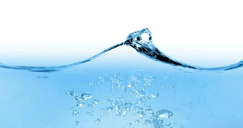 Blue wave water with bubbles in tank on white background, slow motion Vidéo 87811491