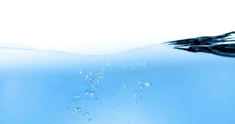Blue wave water with bubbles in tank on white background, slow motion movement Stock Footage 95963229