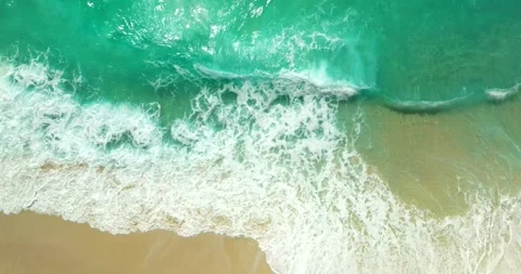 Blue waves at the beach aerial view form drone camera high quality Stock Footage 310386378