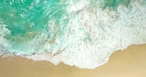 Blue waves at the beach aerial view form drone camera high quality Stock Footage 310386687