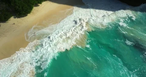Blue waves at the beach aerial view form drone camera high quality Stock Footage 310401399