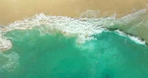 Blue waves at the beach aerial view form drone camera high quality Stock Footage 310401795