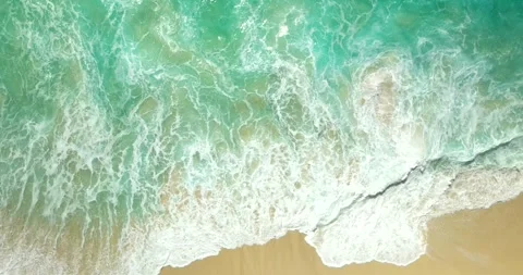 Blue waves at the beach aerial view form drone camera high quality Stock Footage 310402024