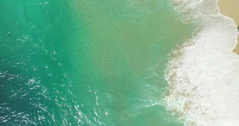 Blue waves at the beach aerial view form drone camera high quality Stock Footage 310488764