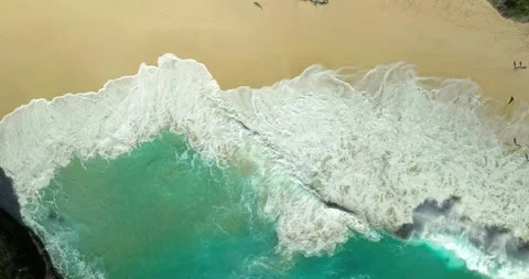 Blue waves at the beach aerial view form drone camera high quality Stock Footage 310535907