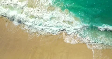 Blue waves at the beach aerial view form drone camera high quality Stock Footage 310593936