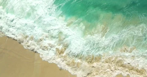 Blue waves at the beach aerial view form drone camera high quality Stock Footage 310646094