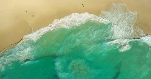 Blue waves at the beach aerial view form drone camera high quality Stock Footage 310962521