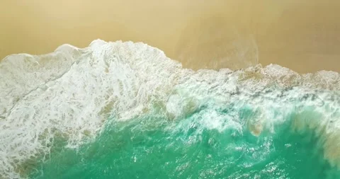 Blue waves at the beach aerial view form drone camera high quality Stock Footage 311385576