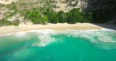 Blue waves at the beach aerial view form drone camera high quality Stock Footage 311385616