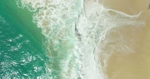 Blue waves at the beach aerial view form drone camera high quality Stock Footage 311385725