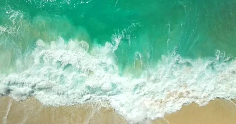 Blue waves at the beach aerial view form drone camera high quality Stock Footage 311385751