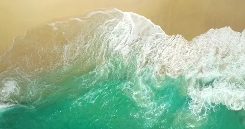 Blue waves at the beach aerial view form drone camera high quality Stock Footage 311413901