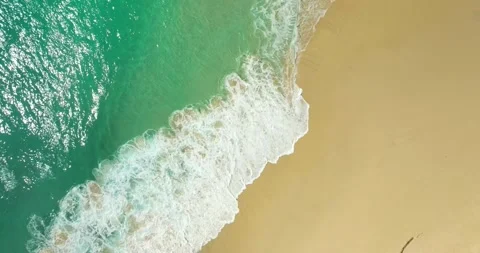 Blue waves at the beach aerial view form drone camera high quality Stock Footage 311591576